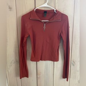 Burnt orange long sleeve blouse.